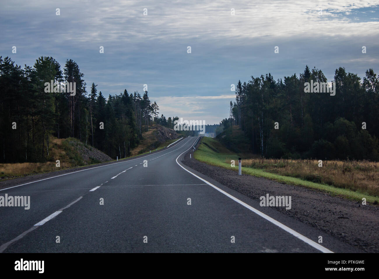 Russian roads in Karelia. Travel by road. Asphalt road. Smooth road car. Stock Photo