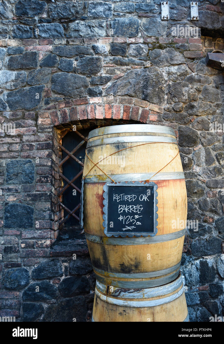 Used oak wine barrels for sale at Castello di Amorosa winery, housed in a reproduction 13-century medieval Italian stone castle in Calistoga, Californ Stock Photo