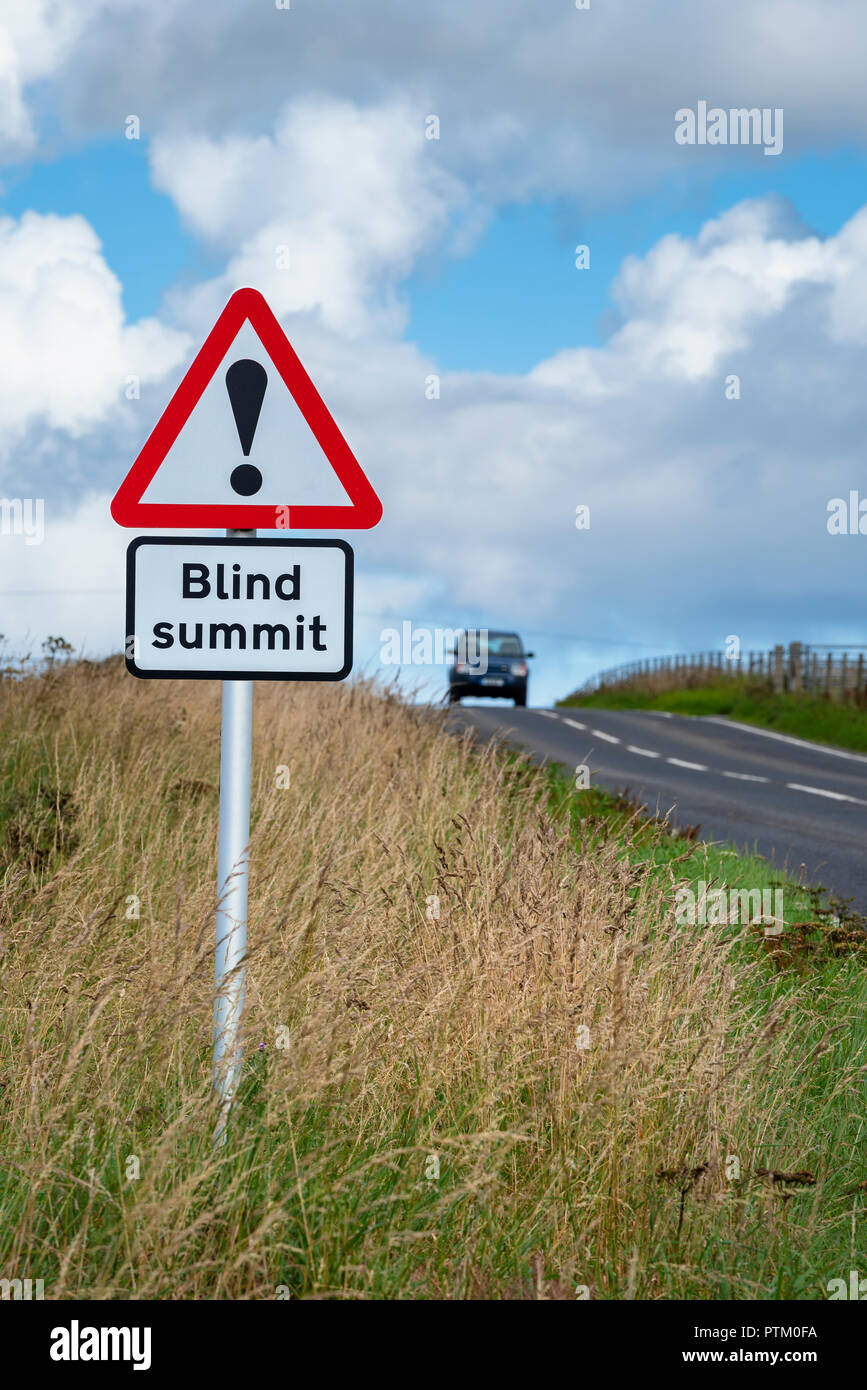 Traffic sign with warning sign of an unseen roadtop, Scotland, Great Britain Stock Photo