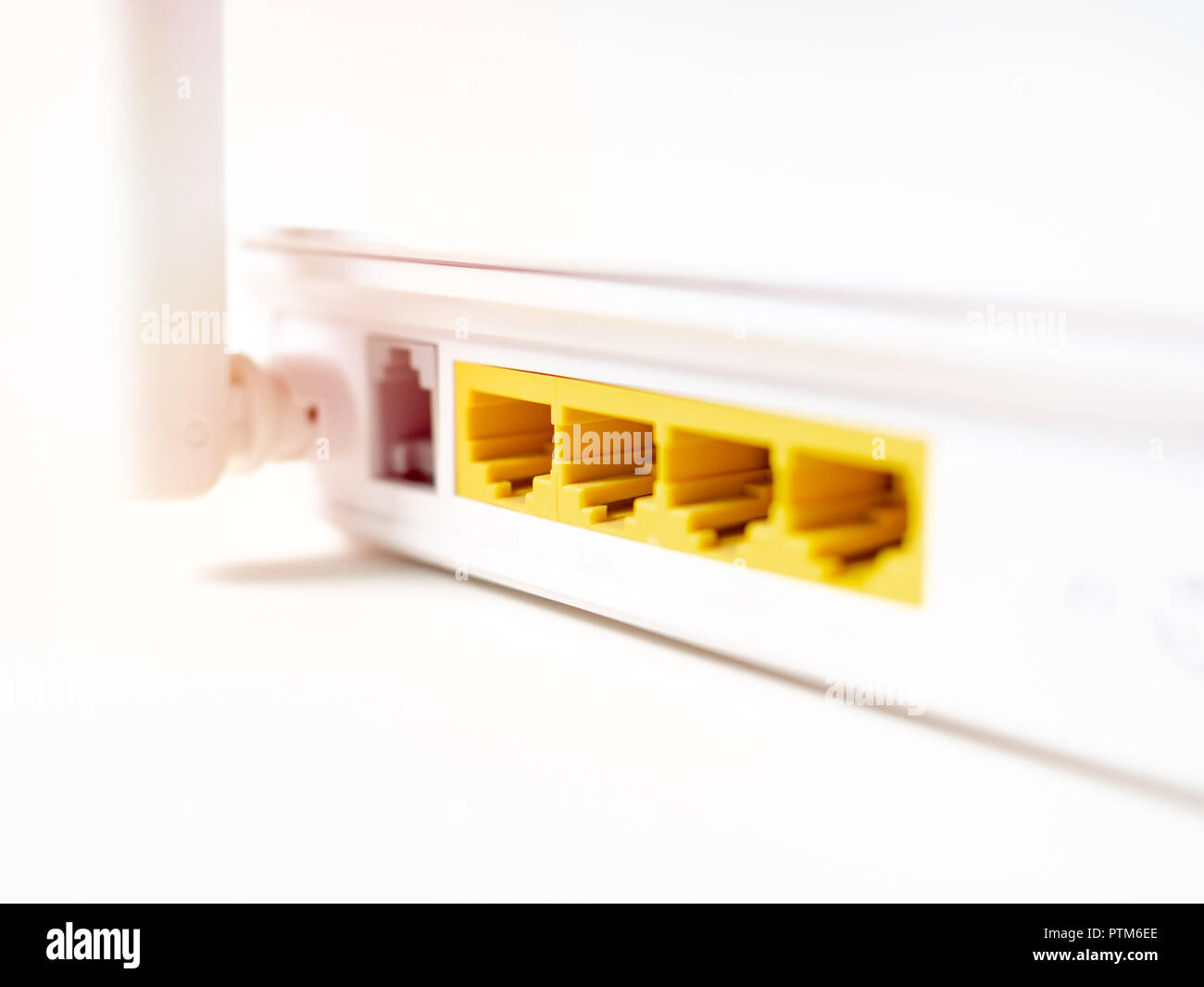 Close-up white wireless WI-FI router internet network hub without patch ...