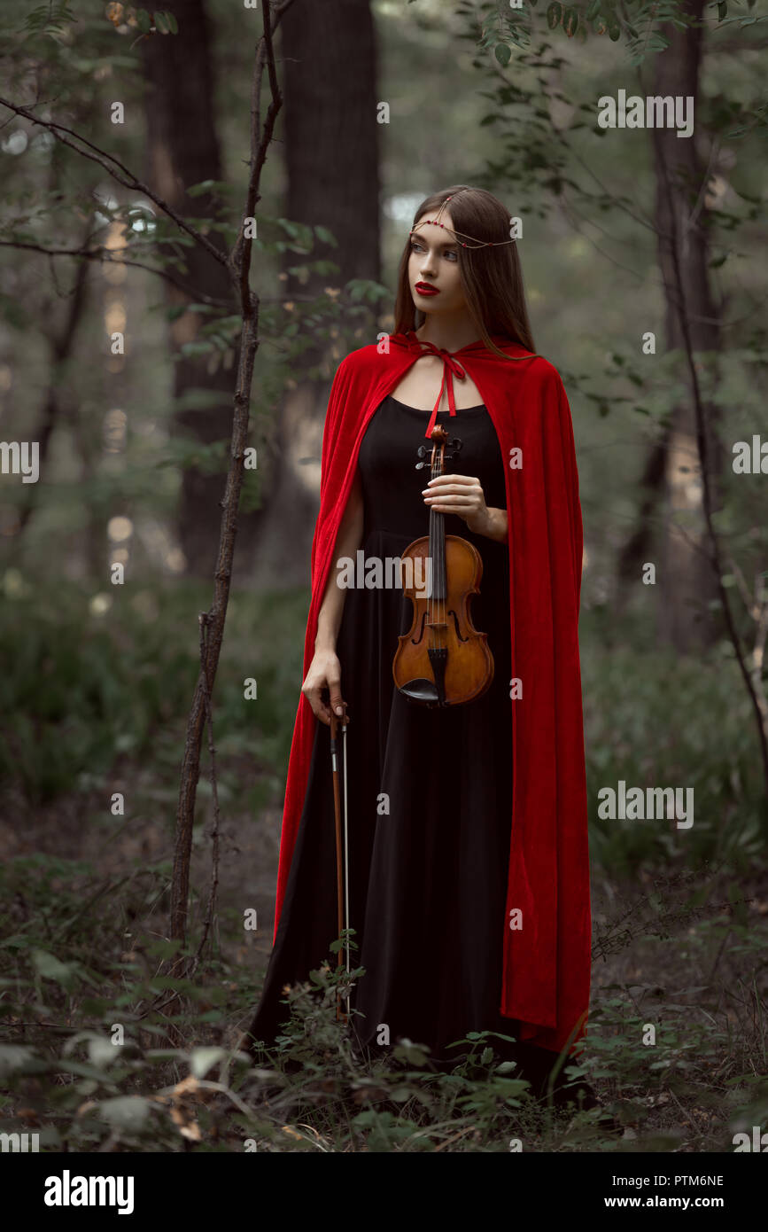 Beautiful woman in red cloak hi-res stock photography and images - Alamy