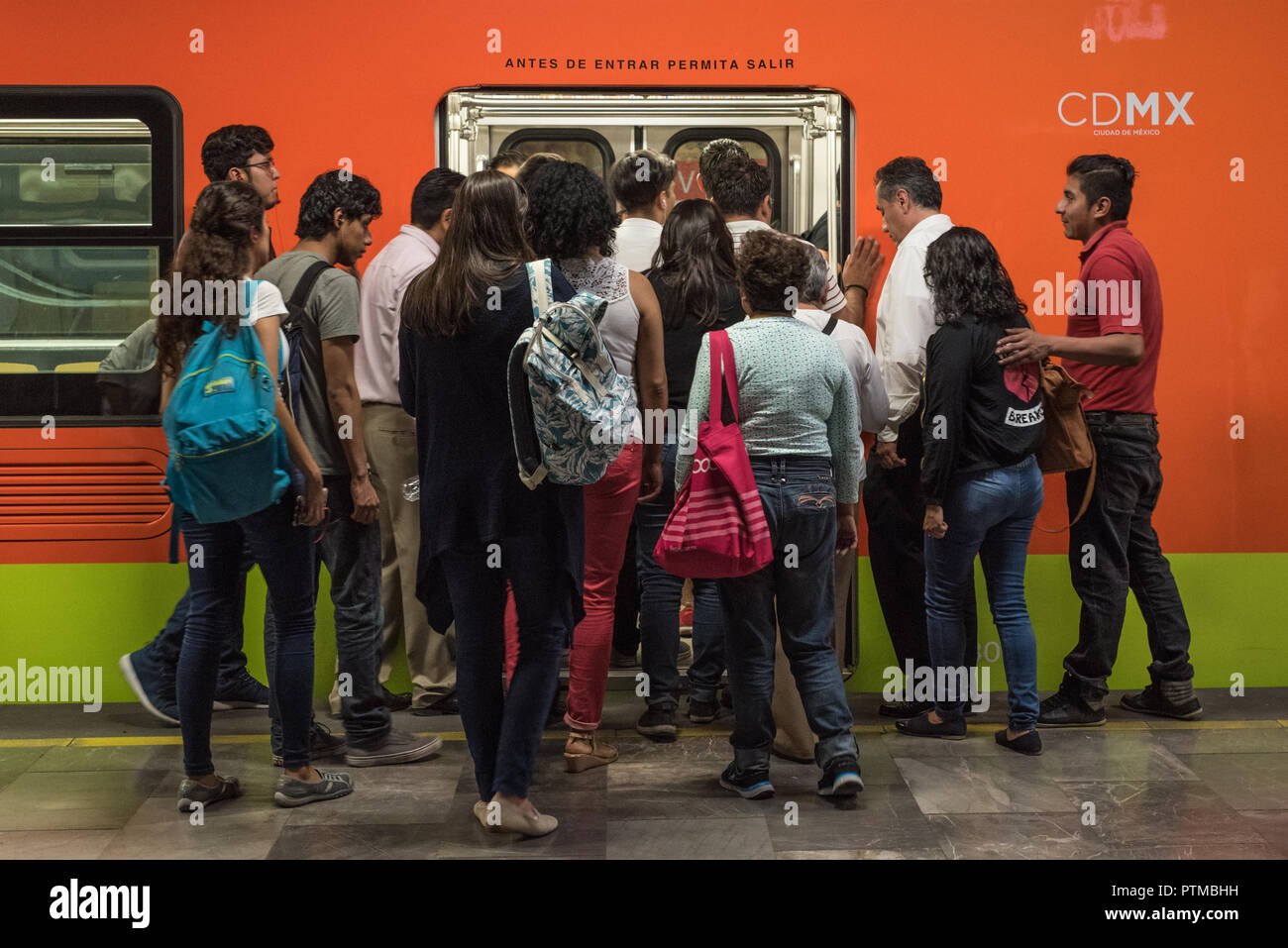 Mexican people enter a train at the Insurgentes Sur metro station Stock Photo