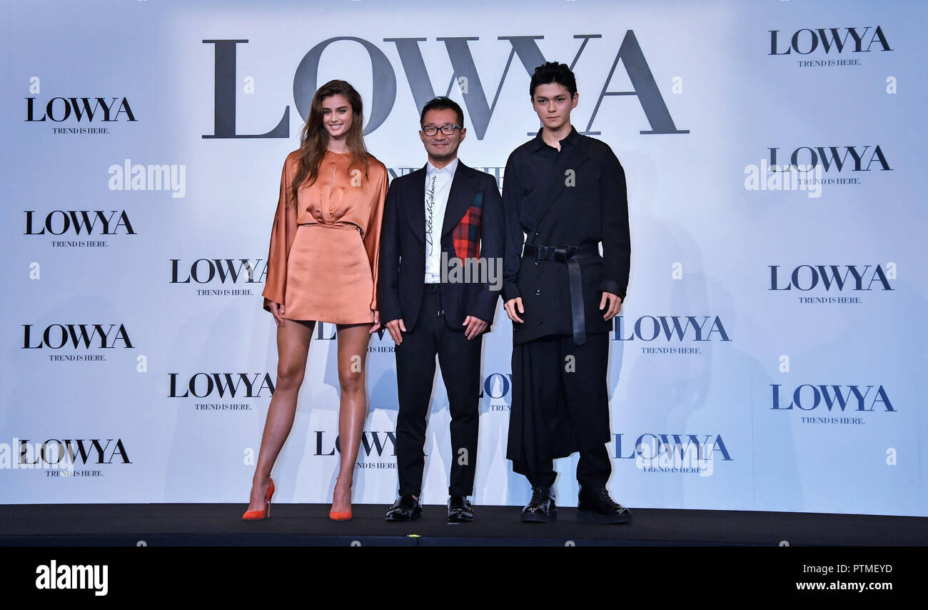 (L-R) Model Taylor Hill, CEO of Vega Corporation Tomokazu Ukishiro and