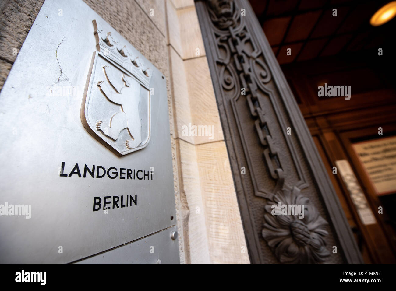 08 October 2018, Berlin: The sign with the inscription 'Landgericht Berlin' at the entrance of the court in Moabit. Photo: Fabian Sommer/dpa Stock Photo