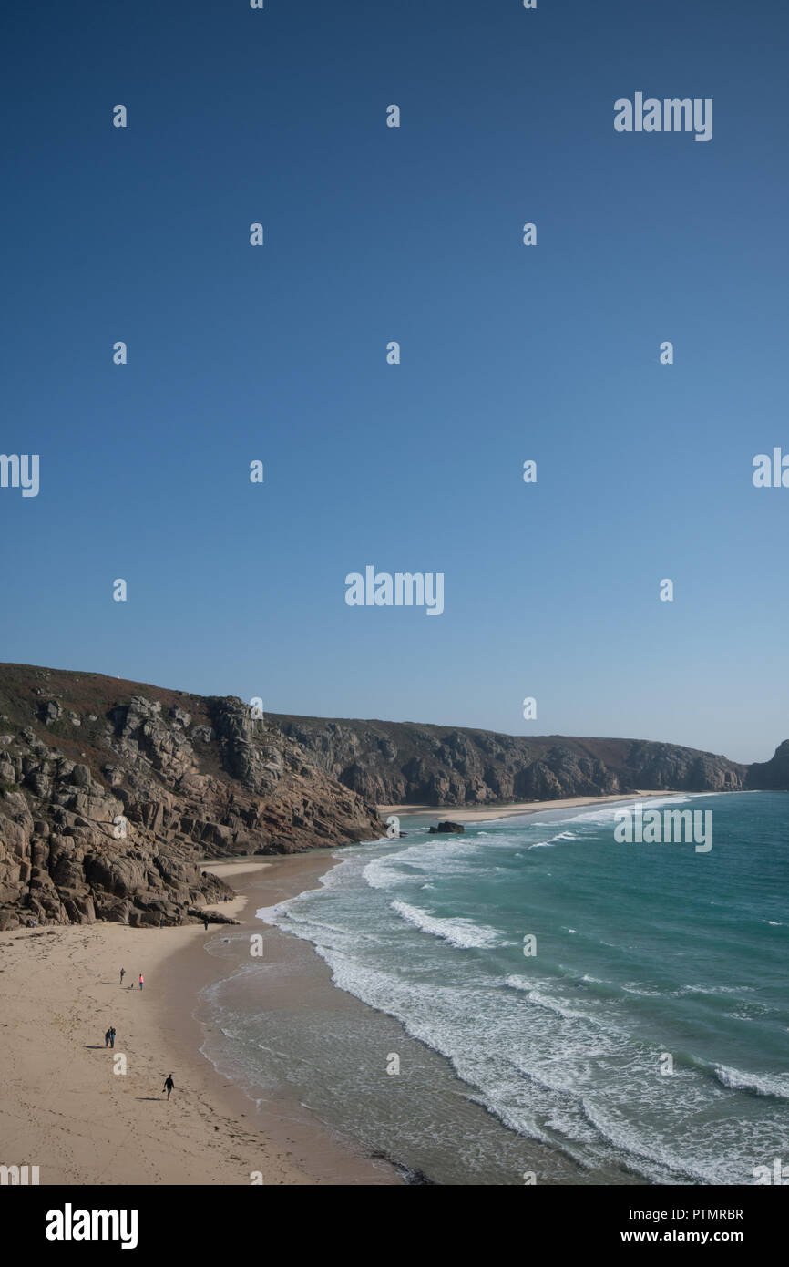 Porthcurno, Cornwall, UK. 10th October 2018. UK Weather. As temperatures soared across the UK, people were out on the carribean looking beaches in Cornwall making the most of the golden sands and turquoise seas. Credit: cwallpix/Alamy Live News Stock Photo