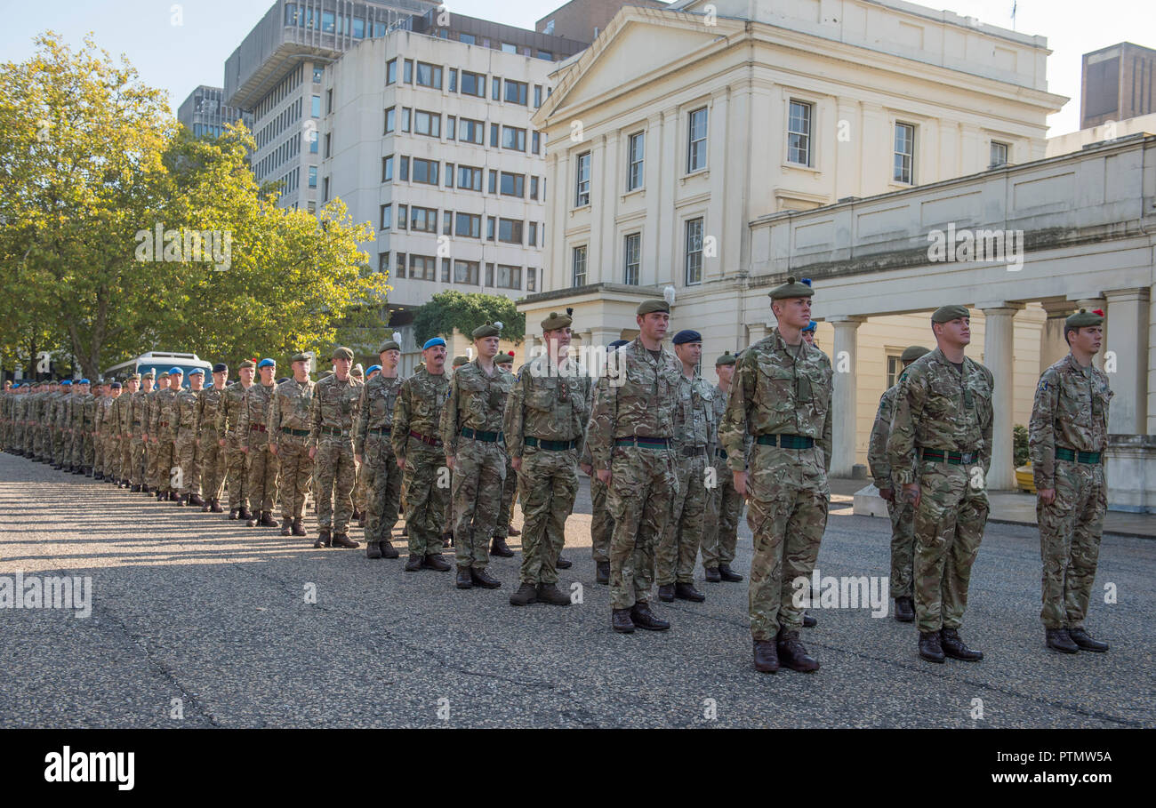 Westminster, London, UK. 10 October, 2018. The Army march to Parliament to be thanked by Parliament for service in not one theatre of operations, but in 55 countries and involves a contingent of 120 Army personnel – a distillation of the 51,726 soldiers who deployed last year to more than 55 countries on operations, defence engagement and training, and the 25,000 troops held in readiness to deploy at any moment. They arrive at Parliament accompanied by the world-famous Band of the Grenadier Guards in full ceremonial dress. Credit: Malcolm Park editorial/Alamy Live News Stock Photo