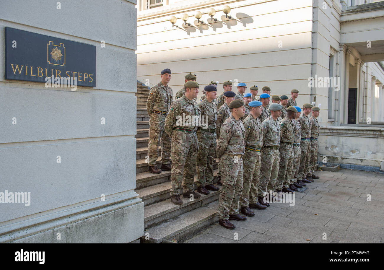 Wellington Barracks, London, UK. 10 October, 2018. The Army march to Parliament to be thanked by Parliament for service in not one theatre of operations, but in 55 countries and involves a contingent of 120 Army personnel – a distillation of the 51,726 soldiers who deployed last year to more than 55 countries on operations, defence engagement and training, and the 25,000 troops held in readiness to deploy at any moment. Troops at Wellington Barracks before the parade along Birdcage Walk. Credit: Malcolm Park/Alamy Live News. Stock Photo