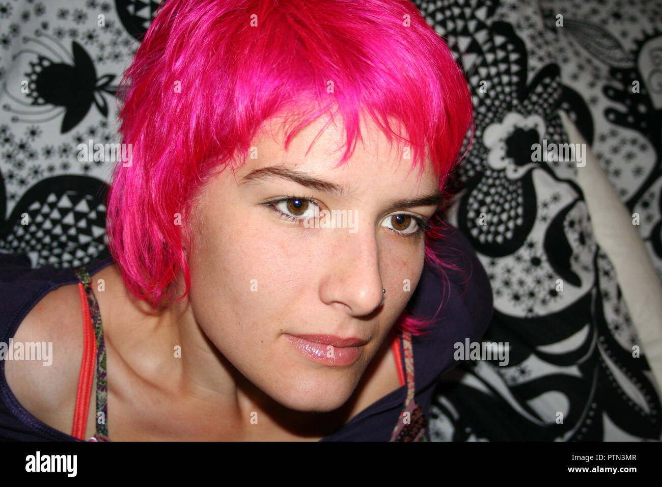 Strong, beautiful woman with dyed hair. Stock Photo