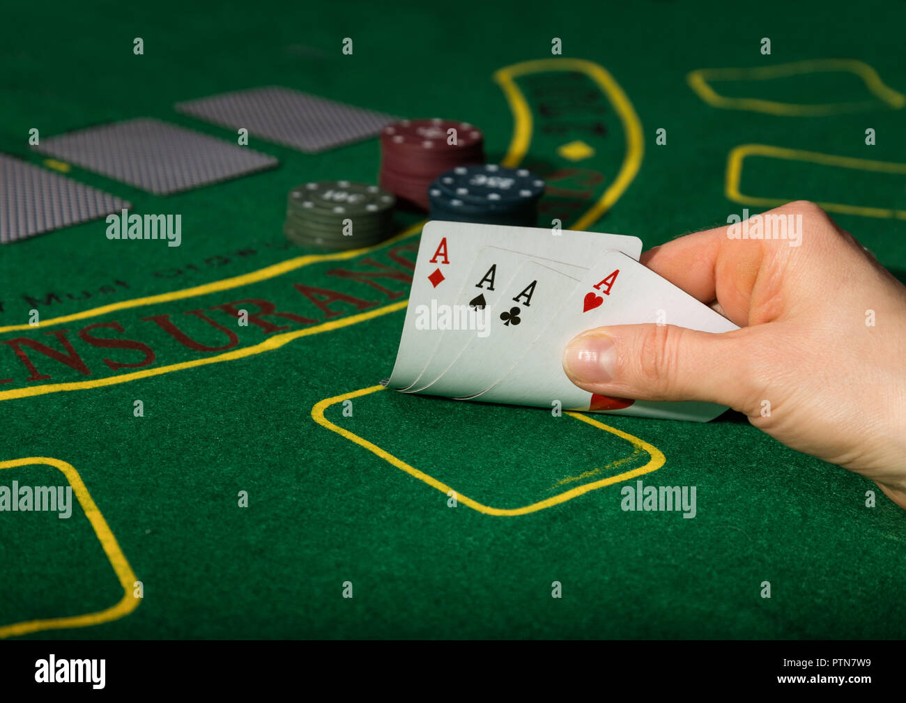 Winning combination in poker game. Cards and chips on a green cloth Stock Photo