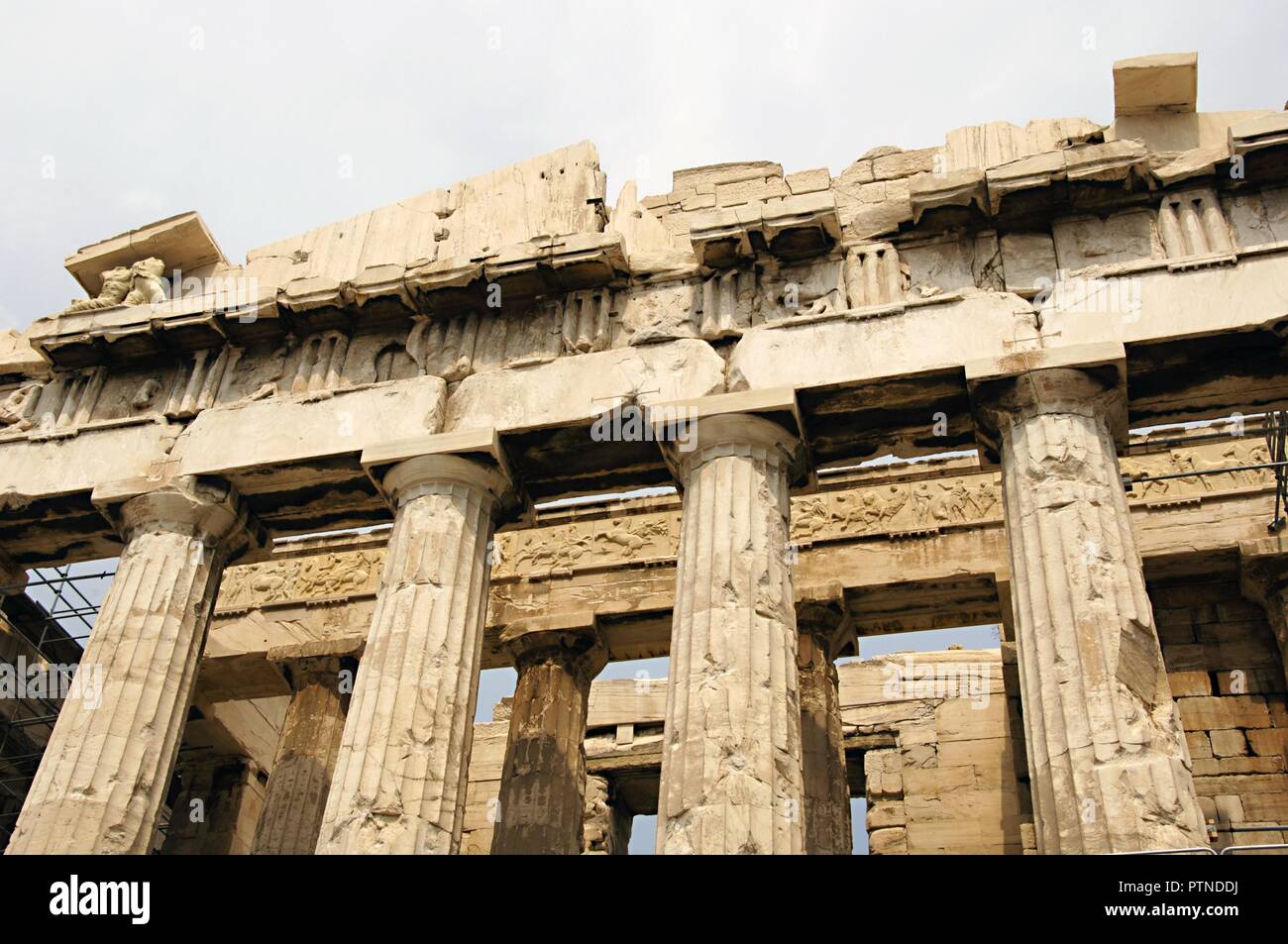 Greece. Athens. Acropolis. Parthenon. Classical temple dedicated to Athena. 447 BC-432 BC. Doric order. Architects: Iktinos and Callicrates. Sculptor Phidias. Pediment, establature with frieze, triglyph, metope, architrave, capital and columns. Architectural detail. Stock Photo