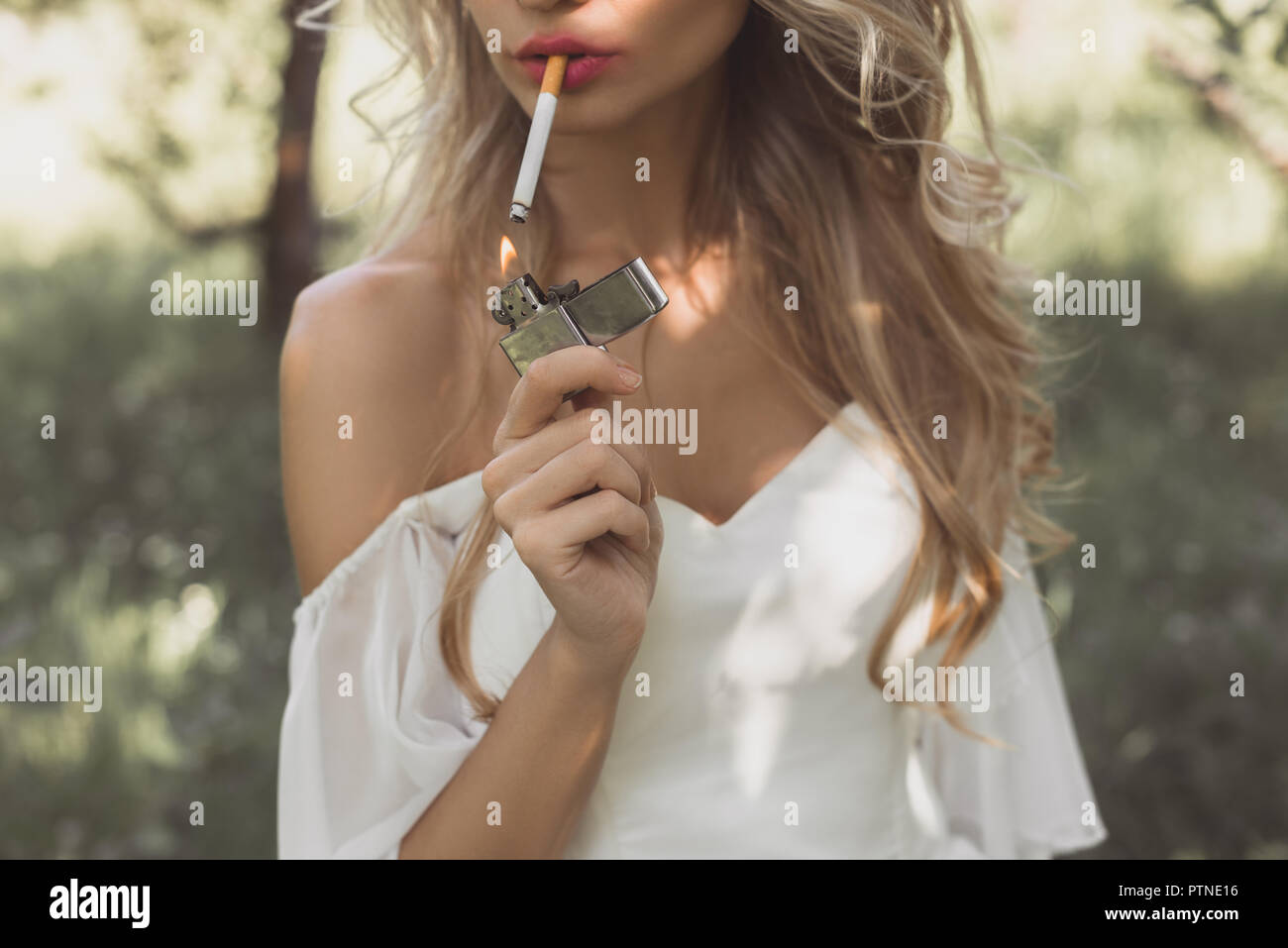 Bride smoking cigarette wedding hi-res stock photography and images - Alamy