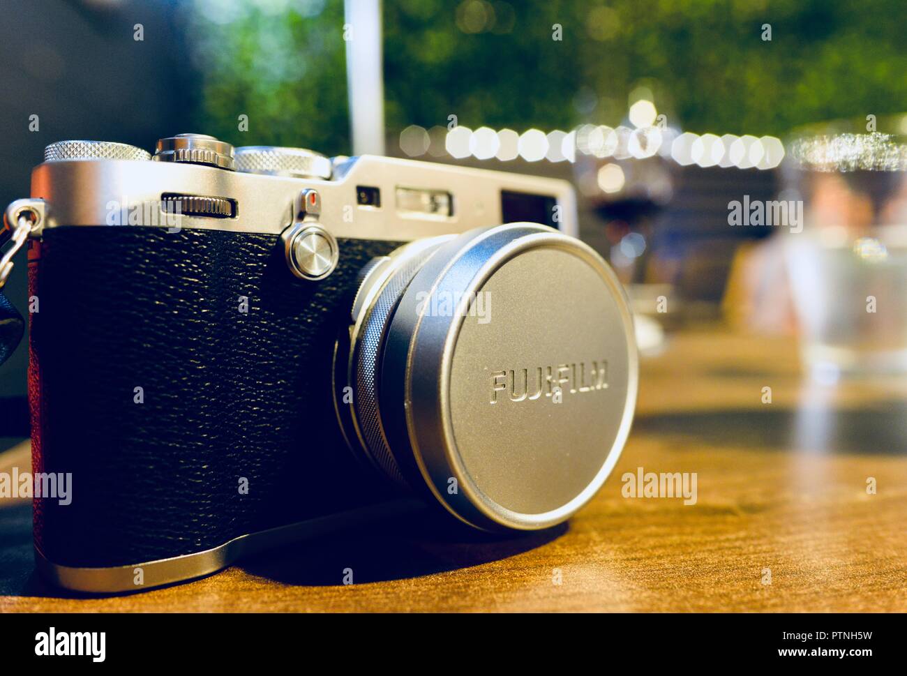 Fujifilm x100f camera on a table at night Stock Photo