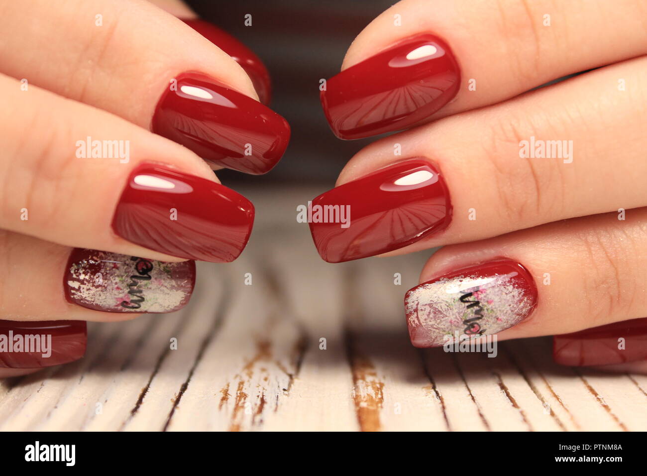 Closeup of woman hands with nail design. Trendy crackle nail polish.  Manicure and nail tattoo trend. Closeup of woman hands on black background.  Fashi Stock Photo - Alamy