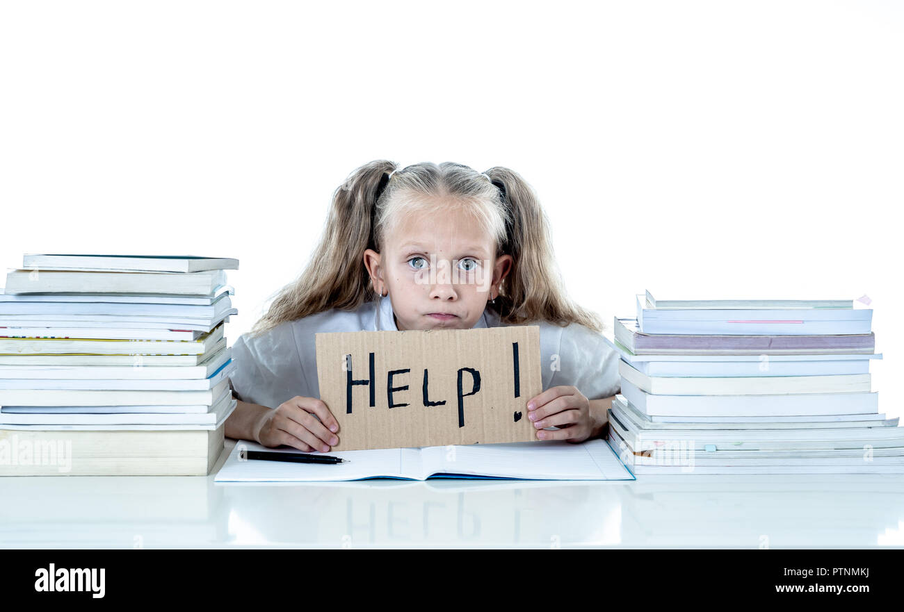 Frustrated little schoolgirl feeling a failure unable to concentrate in