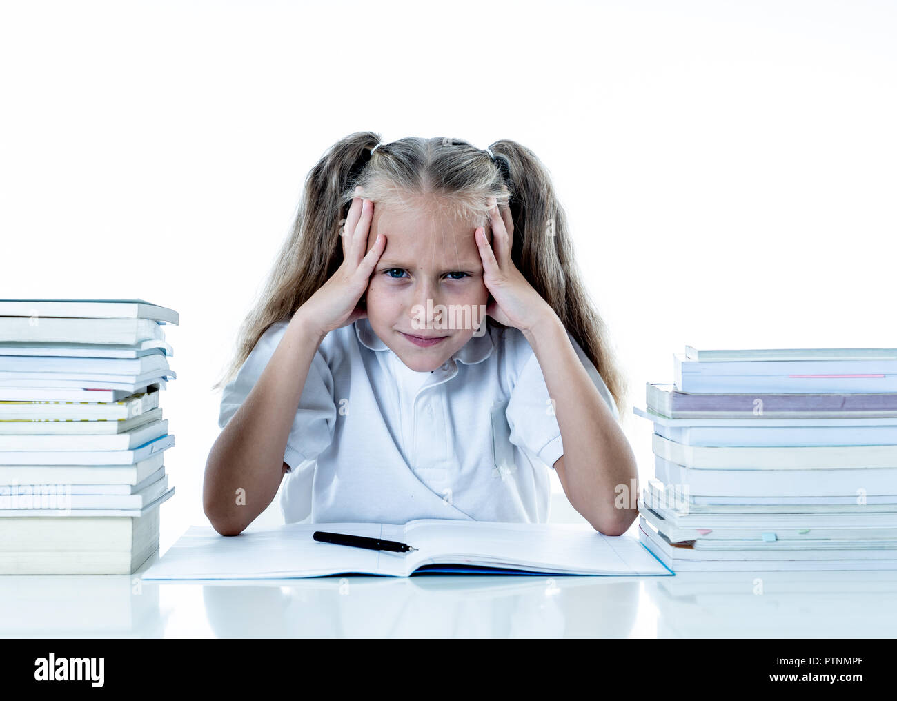 Frustrated little schoolgirl feeling a failure unable to concentrate in