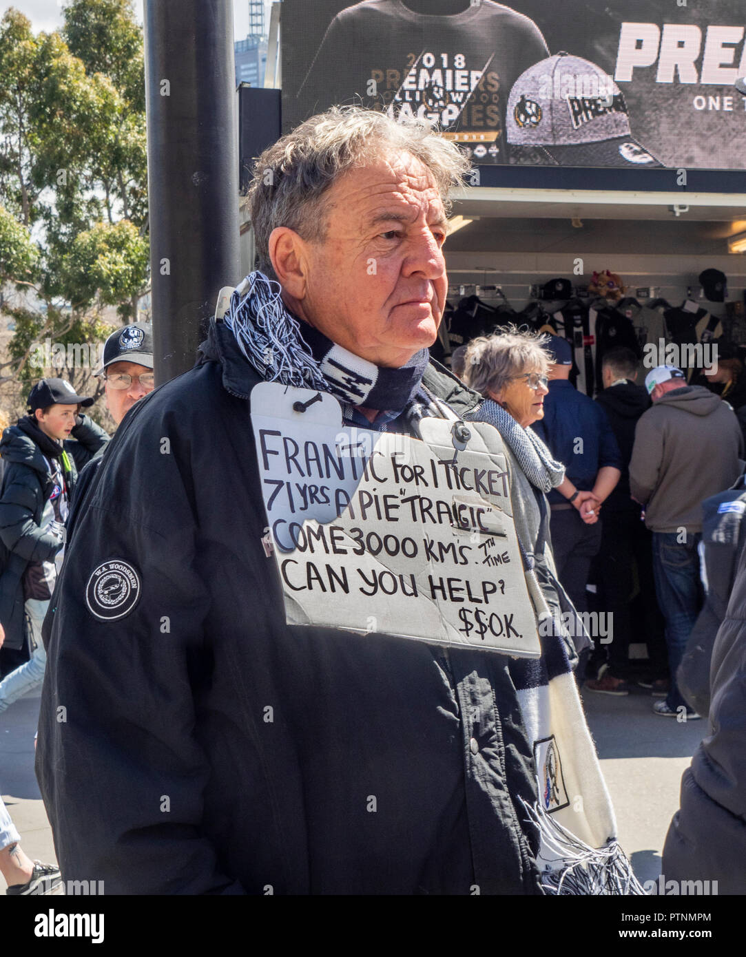 Collingwood Football Club fan and supporter with a sign wanting to buy a ticket to the 2018 AFL Grand Final at MCG, Melbourne Victoria Australia. Stock Photo