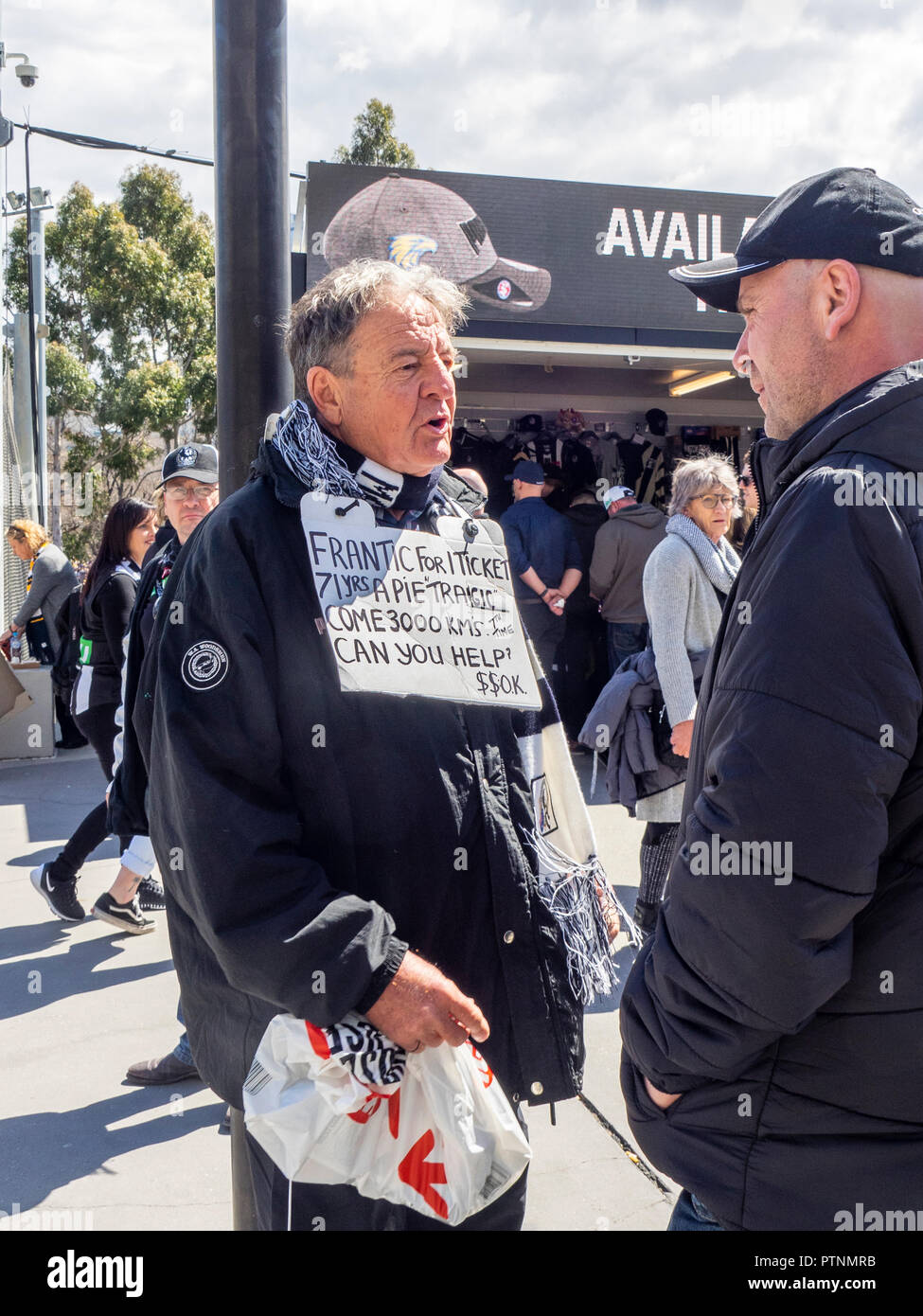 Collingwood Football Club fan and supporter with a sign wanting to buy a ticket to the 2018 AFL Grand Final at MCG, Melbourne Victoria Australia. Stock Photo