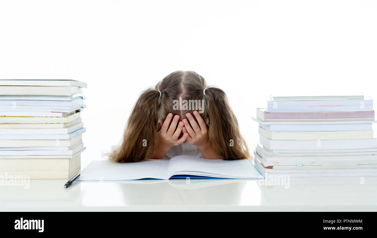 Frustrated little schoolgirl feeling a failure unable to concentrate in