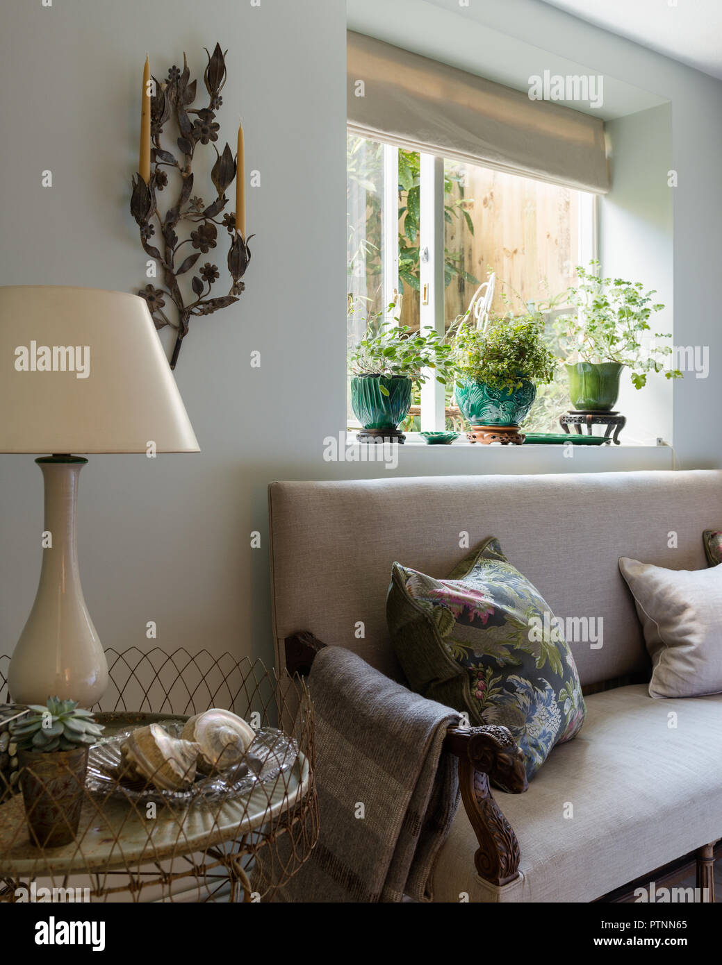 Antique French settle upholstered in plain oatmeal linen with