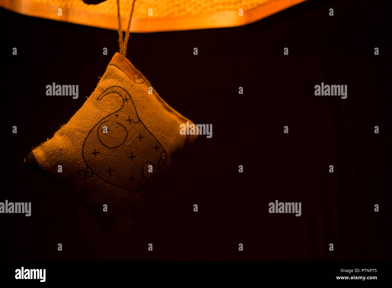 Abstract photto of hanging ornament in the warm light Stock Photo
