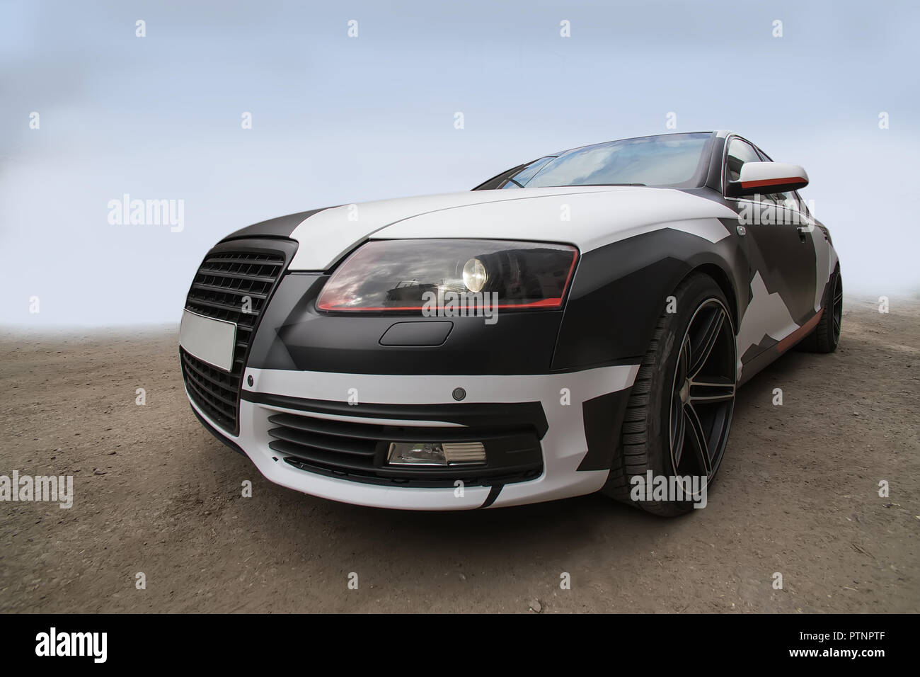Black and white abstract colored sports car on road Stock Photo