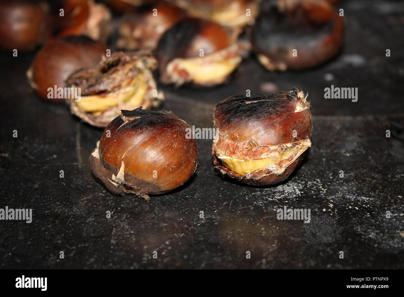 Chestnuts roasting on top of a traditional Lebanese stove called sobia