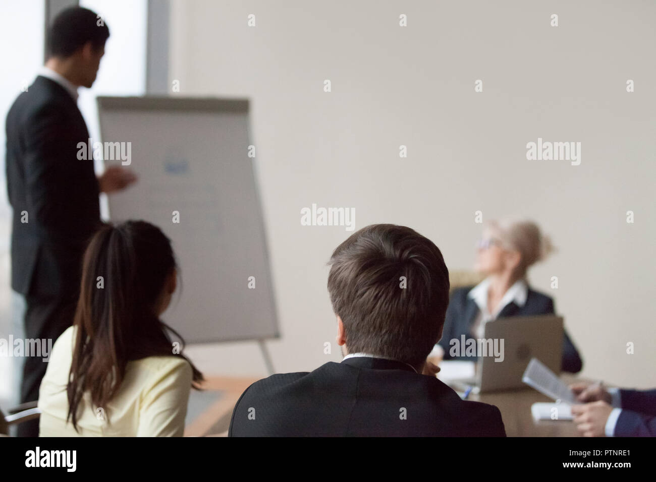 Employee make flipchart presentation for office colleagues Stock Photo