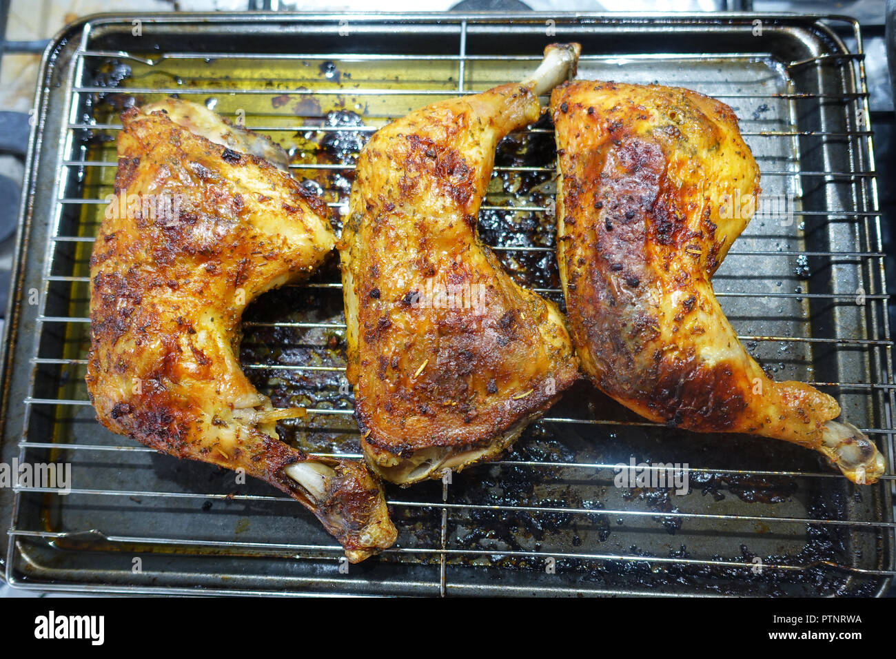 Oven roasted chicken maryland on baking rack Stock Photo