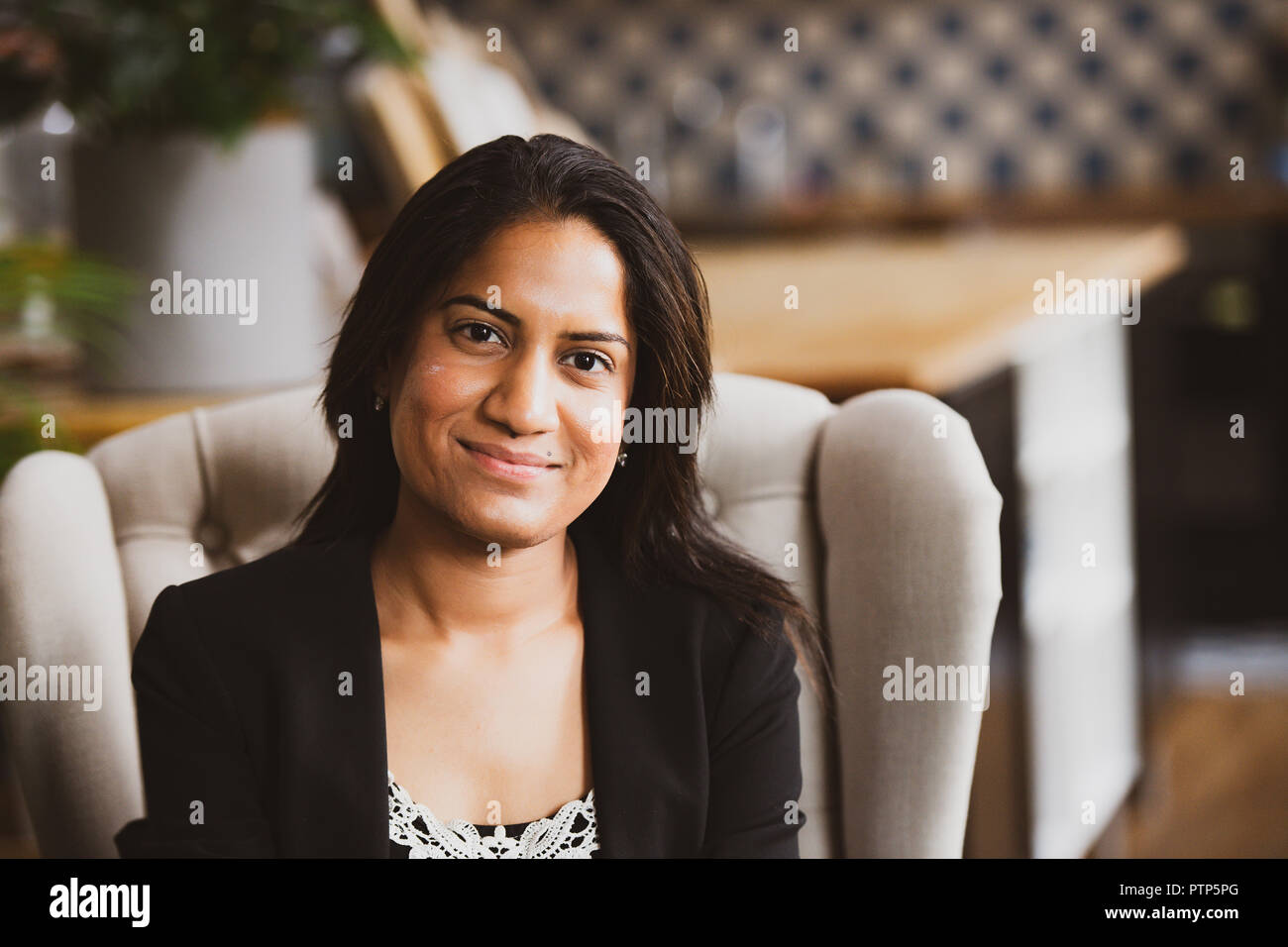 Businesspeople in a co-working space that functions as their office Stock Photo