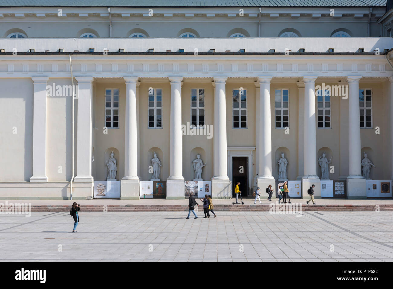 Vilnius Cathedral Square, view of people walking in Cathedral Square against the backdrop of the cathedral's neoclassical columns, Vilnius, Lithuania. Stock Photo