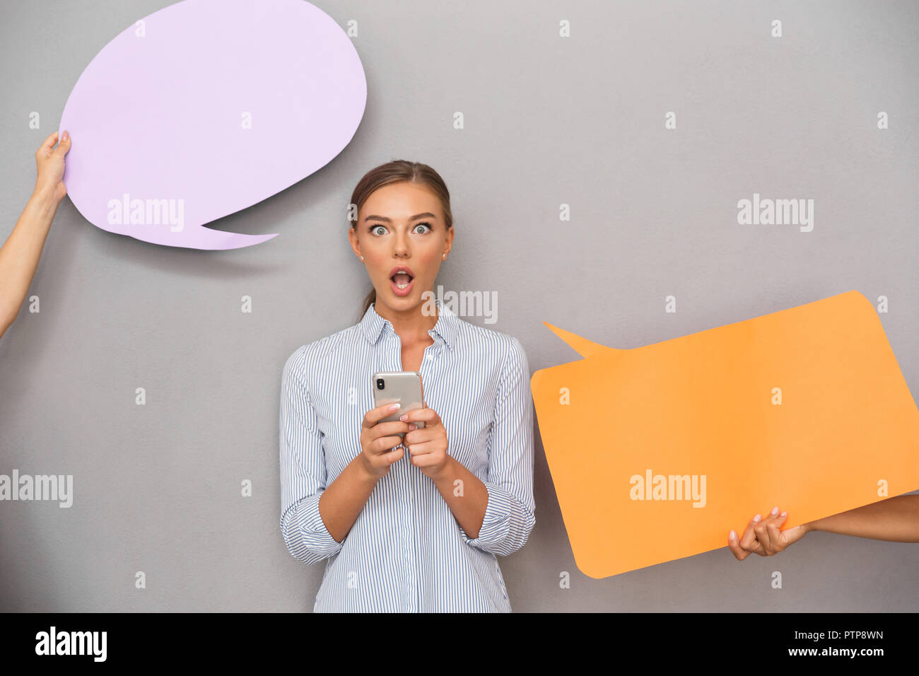 Image of shocked business woman standing over grey wall background with ...