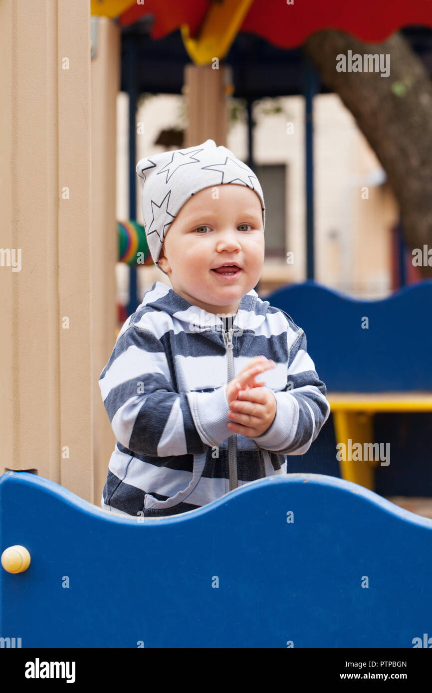 Happy child on playground outdoors (1-2 years old) Stock Photo