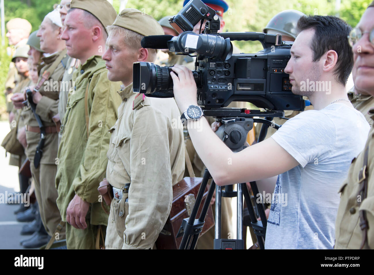 Belarus, Gomel. May 9, 2018. Victory Day. Reconstruction take Reichstag.Videographer shoots report Stock Photo