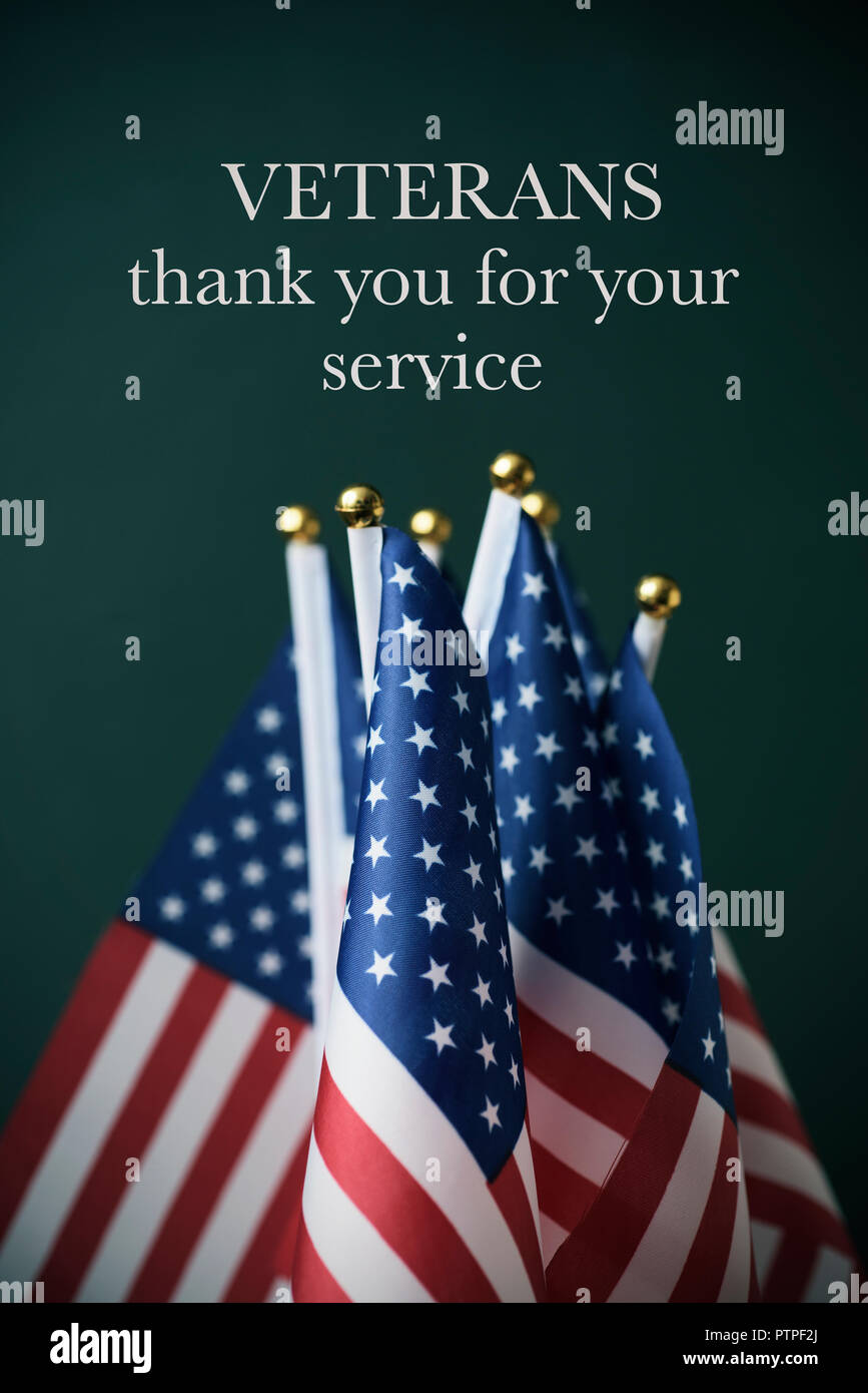 Some American Flags And The Text Veterans Thank You For Your Service Against A Dark Green Background Stock Photo Alamy