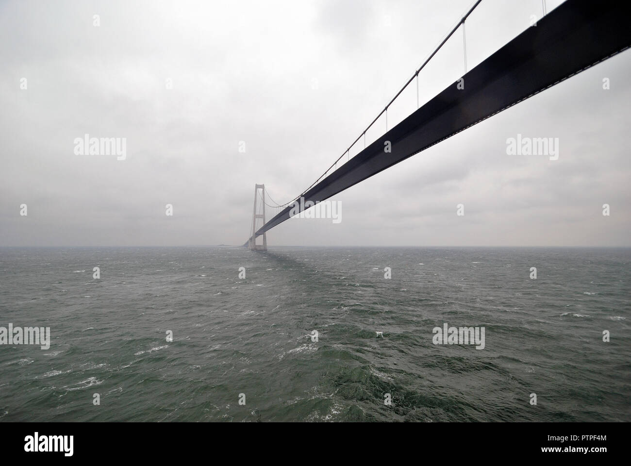Cable-stayed spur through the strait. View from the water. Close-up. Stock Photo