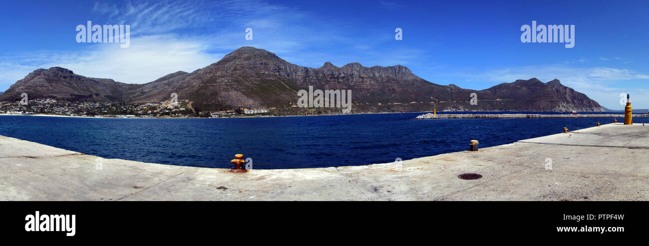 Cape Town and coast line, jetty. Far mountain on the blue sky background. View from the pier. Summer. South Africa Stock Photo