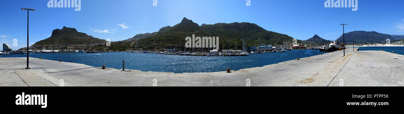 Cape Town and coast line, jetty. Far mountain on the blue sky background. View from the pier. Summer. South Africa Stock Photo