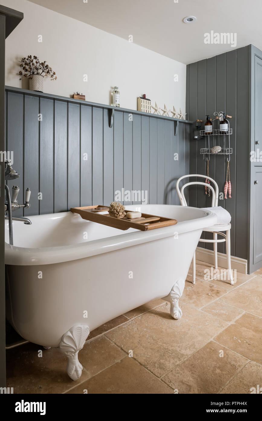 Freestanding bath with rack and ornaments in 18th century Norfolk cottage Stock Photo