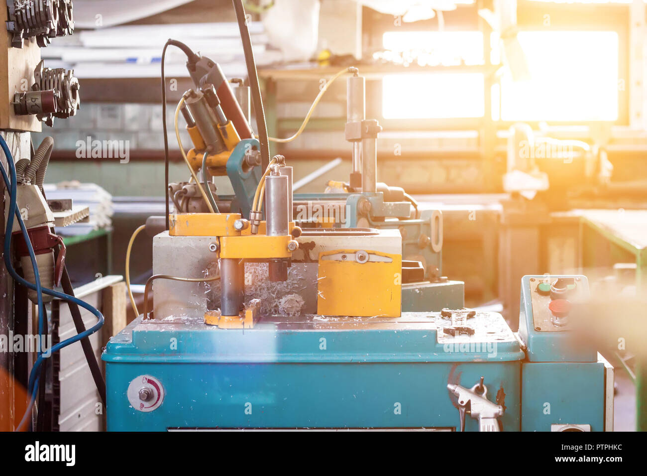 Production of PVC windows, a machine for making holes in the plastic