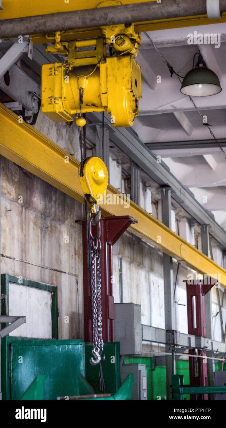 Yellow production crane beam, production crane for lifting cargo, over Stock Photo