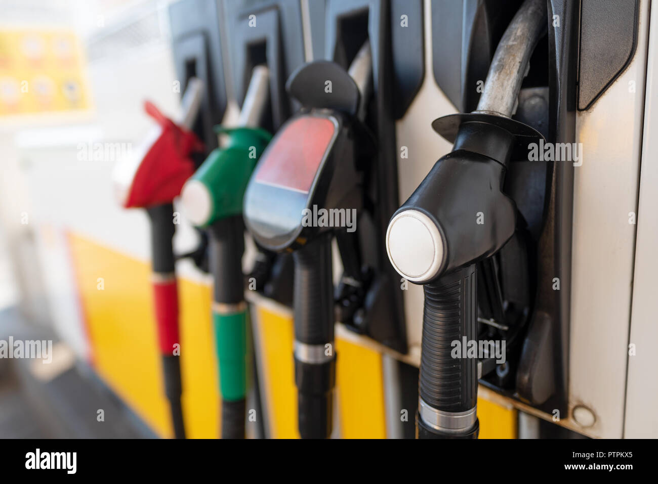 Petrol pump filling nozzles. Fuel at gas station close up Stock Photo