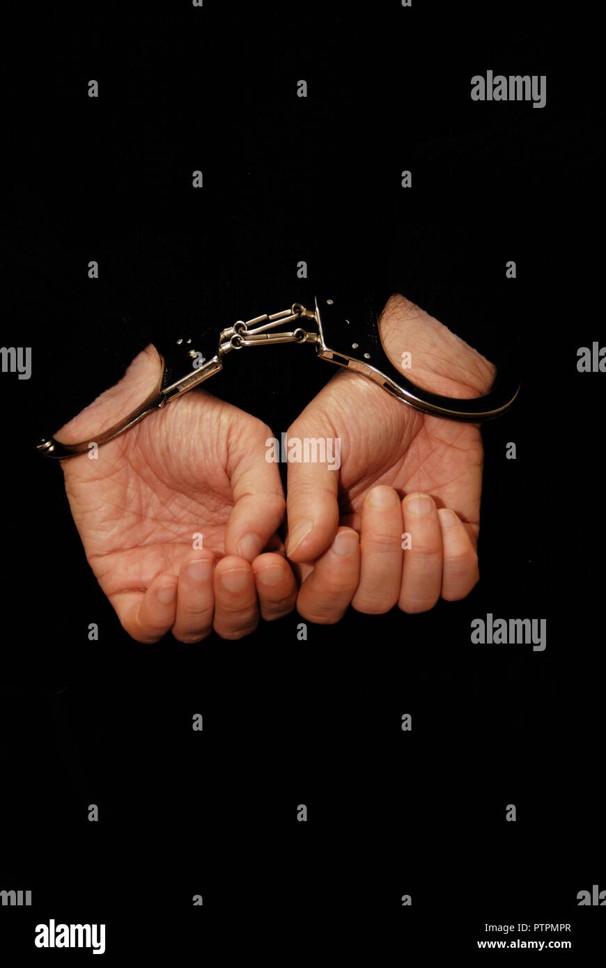 male hands handcuffed, concept for criminal arrested Stock Photo
