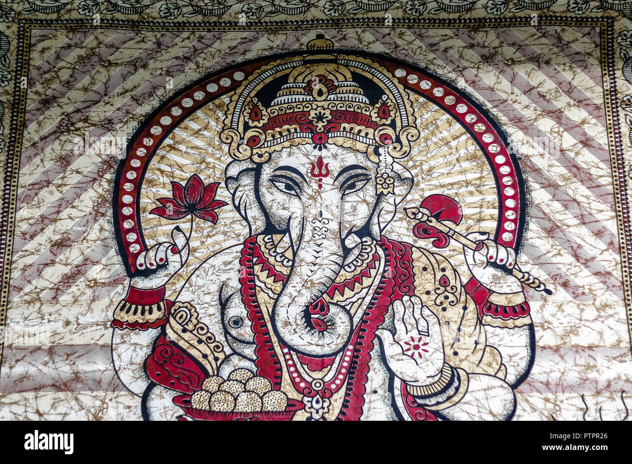 Hippie India tapestry, Hindu god Ganesha printed throw wall hanging on display for sale at Camden Market in London Stock Photo