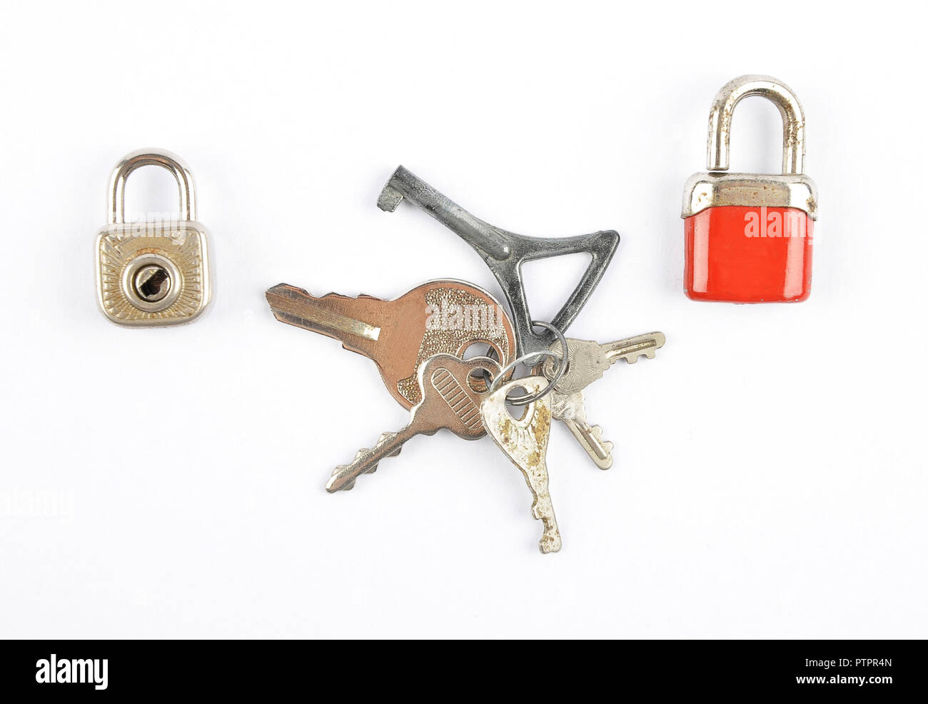 Small padlocks and bunch of keys on white background Stock Photo - Alamy