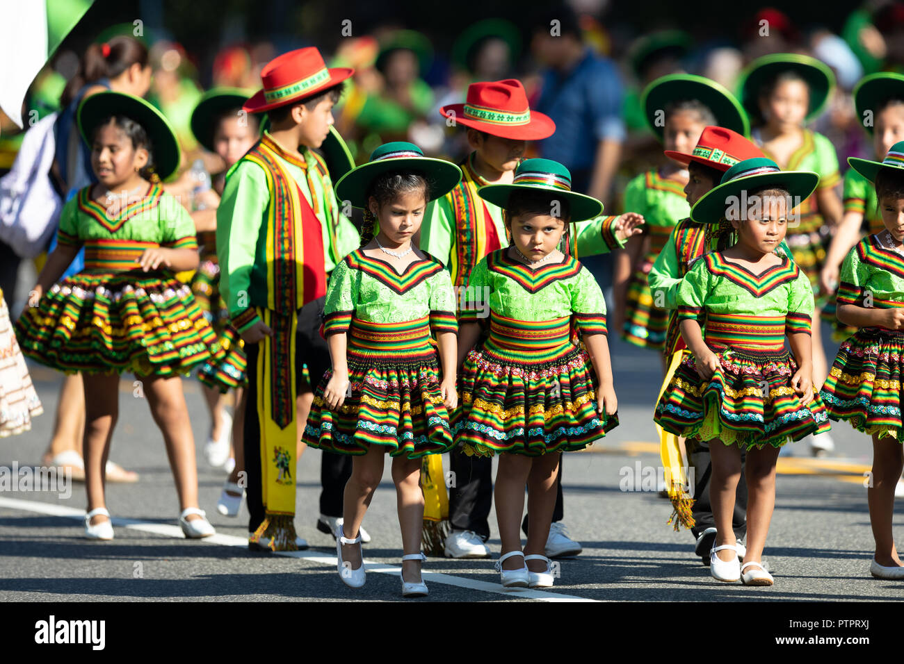 Washington, D.C., USA - September 29, 2018: The Fiesta DC Parade, children from bolivia wearing traditional clothing dancing Stock Photo