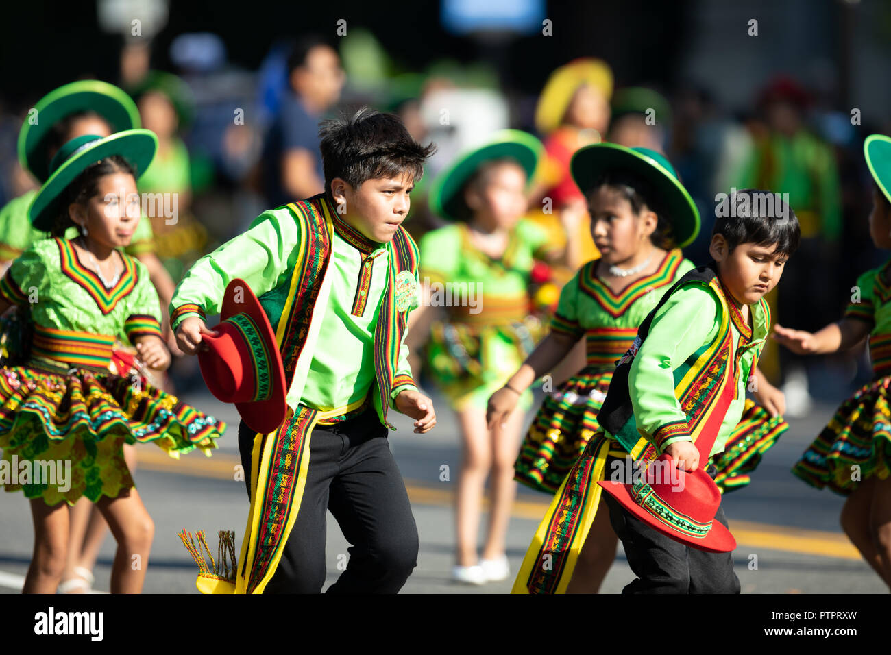 Washington, D.C., USA - September 29, 2018: The Fiesta DC Parade, children from bolivia wearing traditional clothing dancing Stock Photo