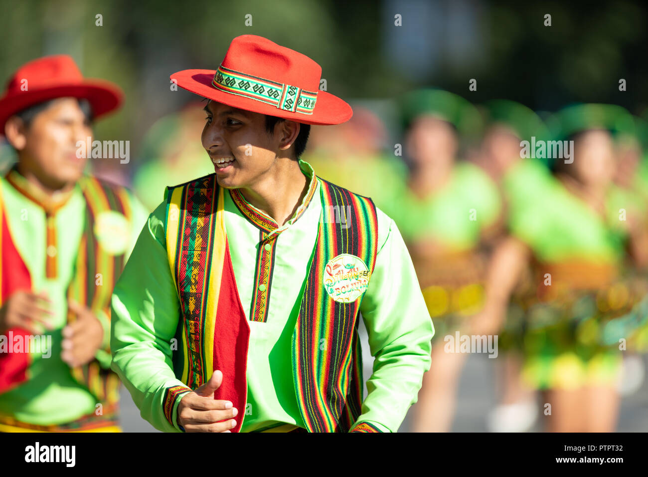 Washington, D.C., USA - September 29, 2018: The Fiesta DC Parade, Bolivian men wearing traditional clothing performing a traditional Bolivian dance Stock Photo