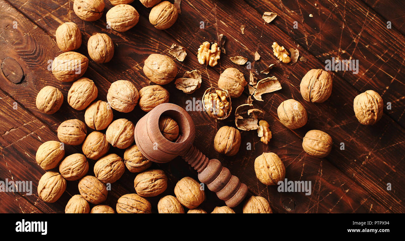 Nutcracker and nuts lying on table Stock Photo Alamy