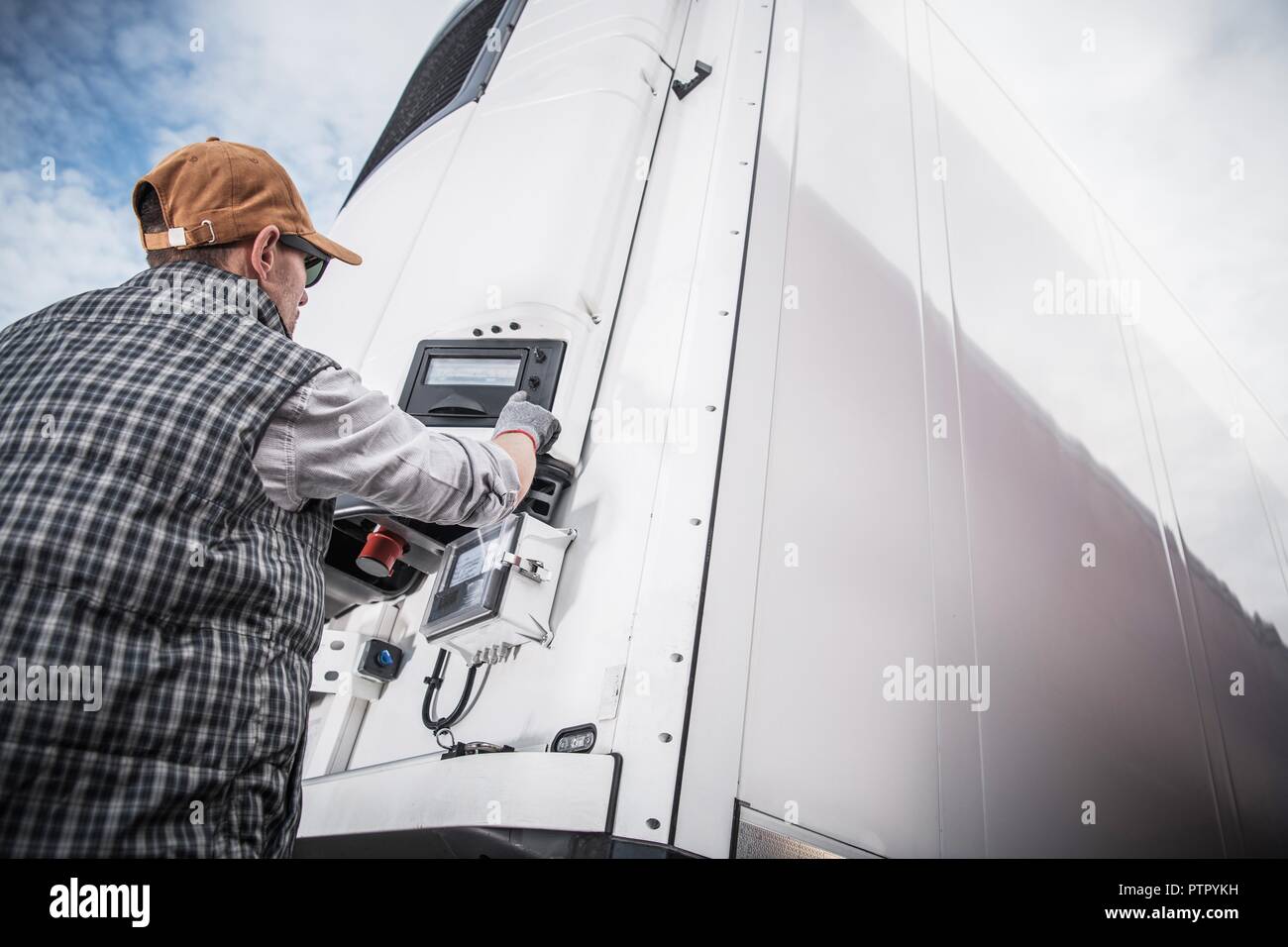 Refrigerated Semitrailer Cargo. Adjusting Temperature by Caucasian