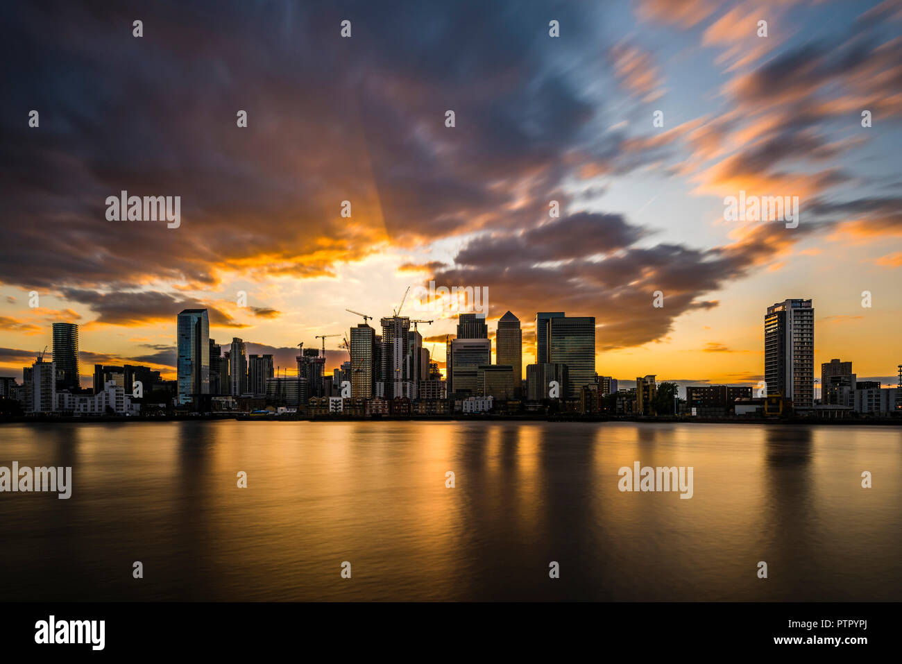 Sunset and dusk over the River Thames and Canary Wharf, London ...